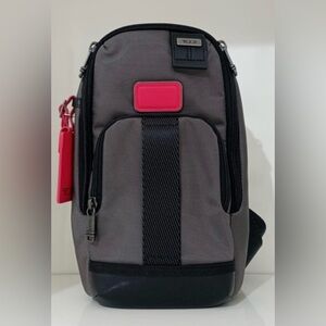 NWT Tumi FIFE Slim Sling Bag Dark Gray Red